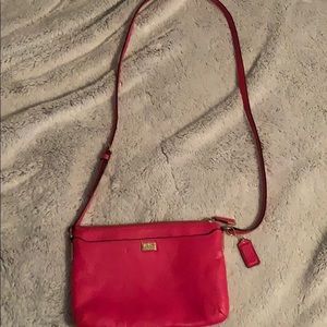 This is a slightly used pink coach bag.